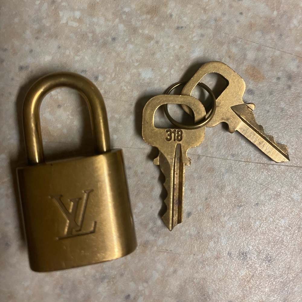 Authentic Louis Vuitton accent Lock and key
